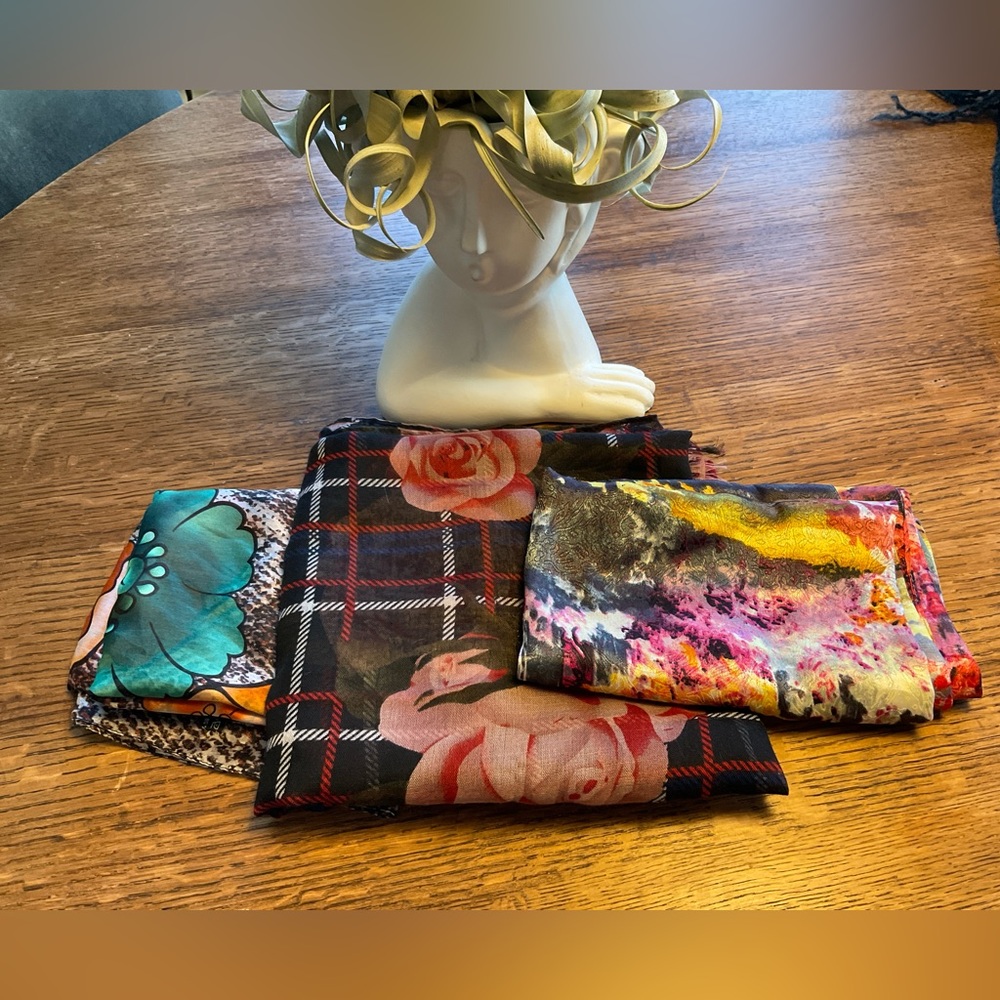 Bundle 3 of long scarves different sizes. One silk scarf and 2 polyesters.